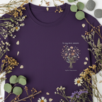 Purple crew-neck t-shirt with botanical bouquet graphic and 'In my own season' text