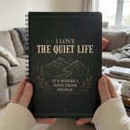 Quiet Life notebook held in a British living room