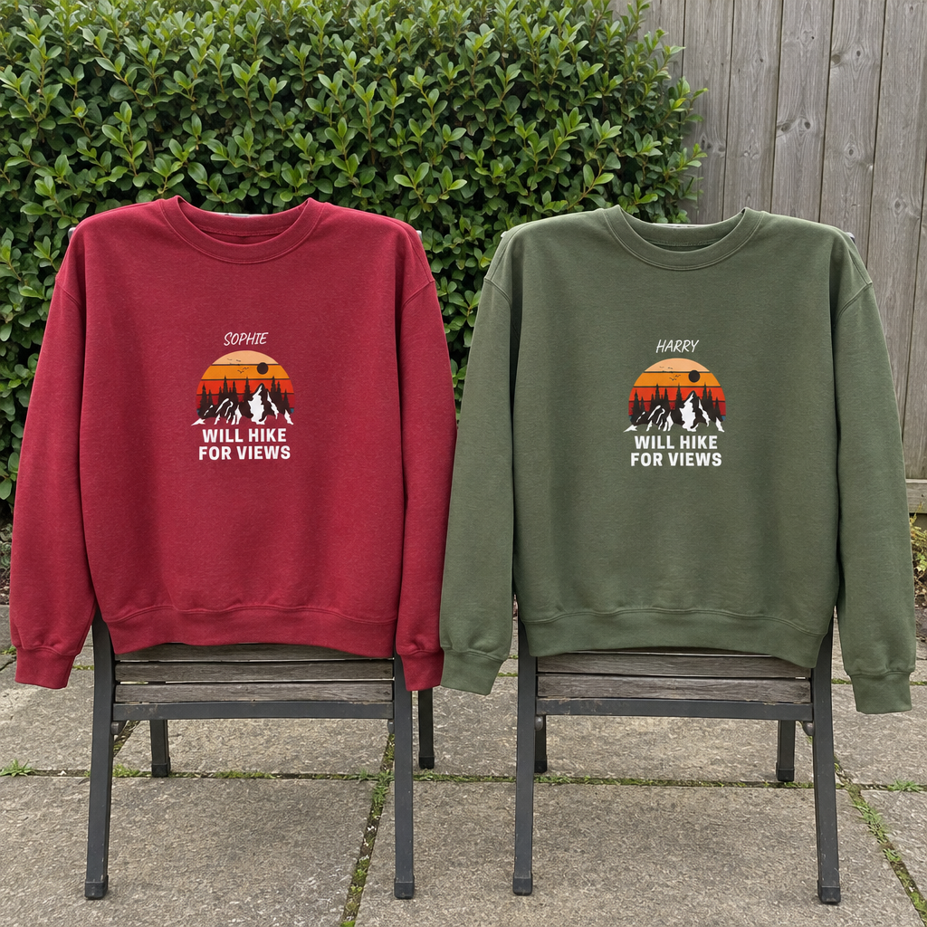 Red and military-green Will Hike for Views sweatshirts on a patio