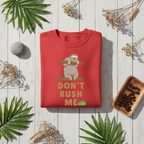 Red sloth graphic sweatshirt with “Don't Rush Me” and palm plant accents