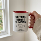 Red-rimmed climbing mug held naturally beside a kitchen window