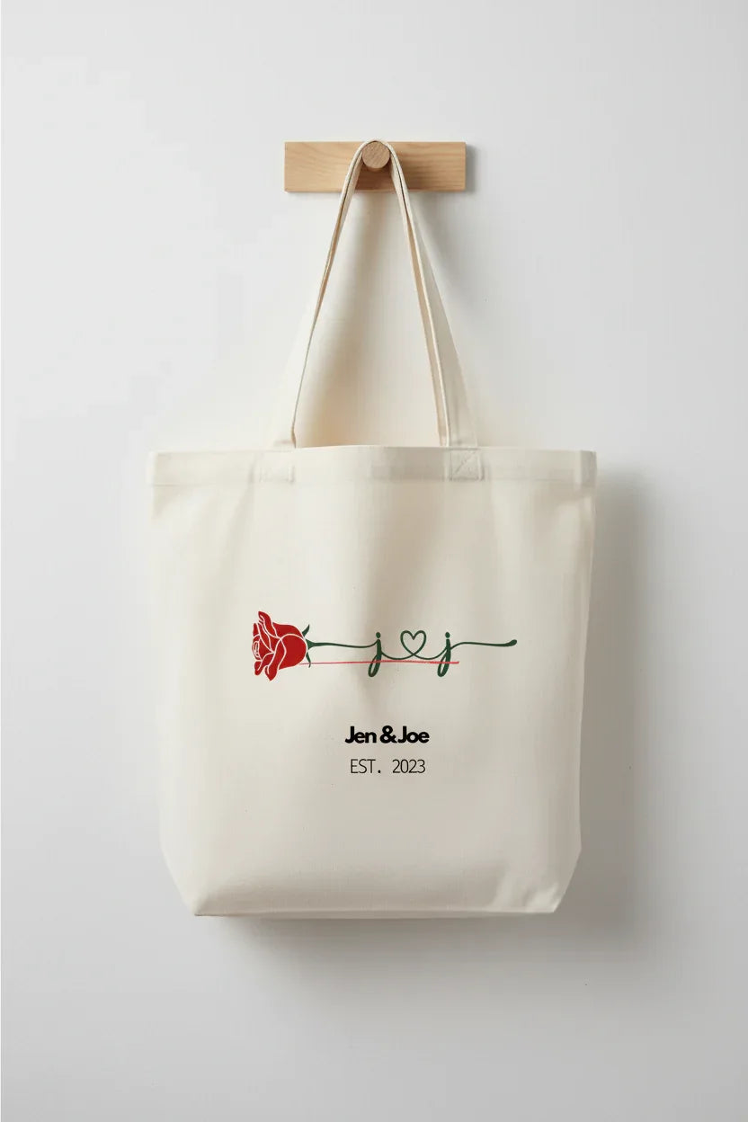 White personalized rose tote bag with red rose print and 'Jen&Joe' text