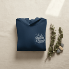 Navy folded hoodie with front pocket and chest logo graphic.