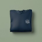 Dark blue folded hoodie with front pocket and chest logo graphic.