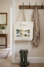 White canvas tote bag with a printed lakeside boardwalk landscape on the front.