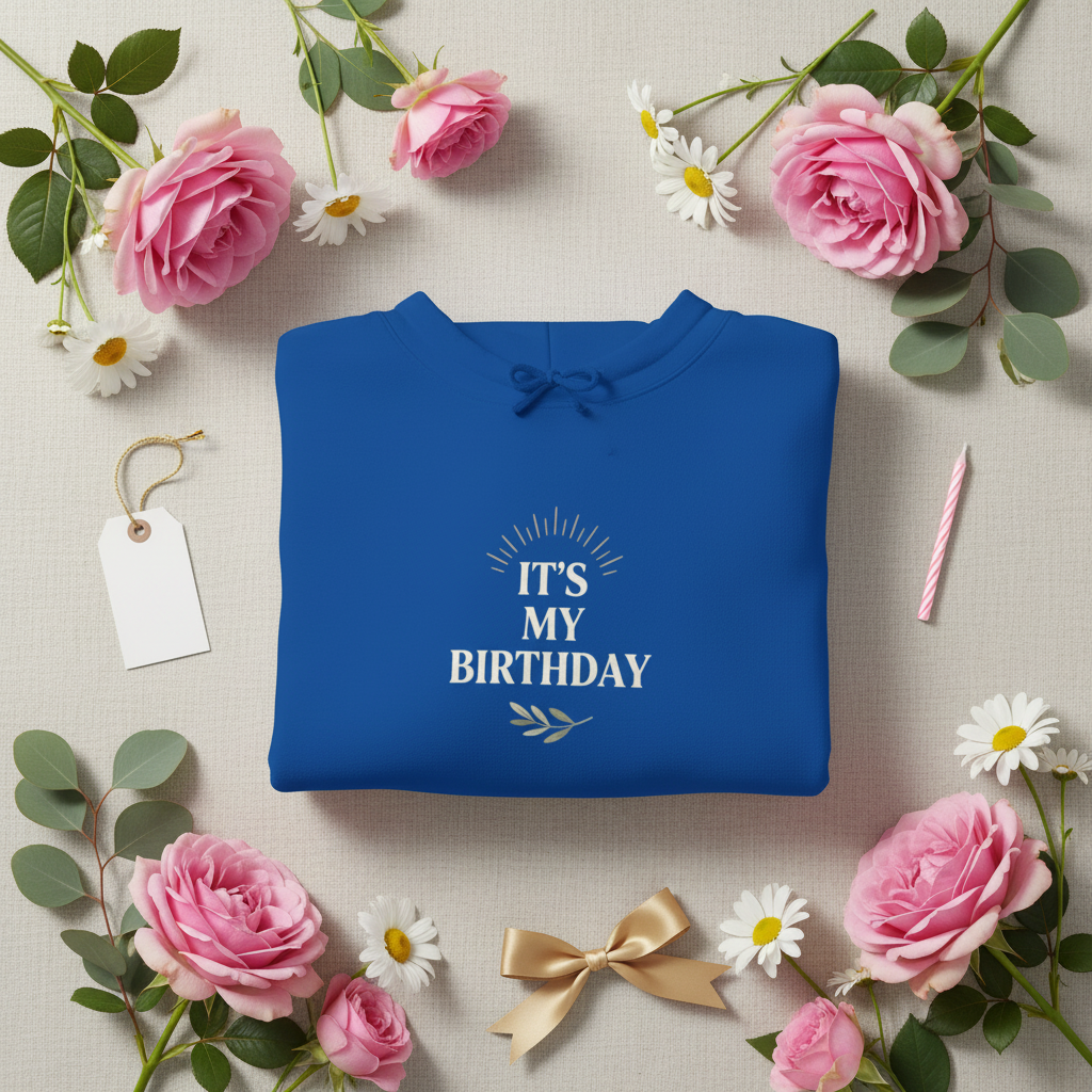 Blue hooded sweatshirt, folded, with 'It's My Birthday' chest graphic