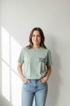 Seafoam green crewneck T-shirt with "Birthday Energy" text graphic