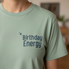 Seafoam Birthday Energy T-shirt with front text graphic and small sparkle accents