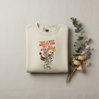 Cream crewneck sweatshirt flat lay with floral Take a Deep Breath text graphic