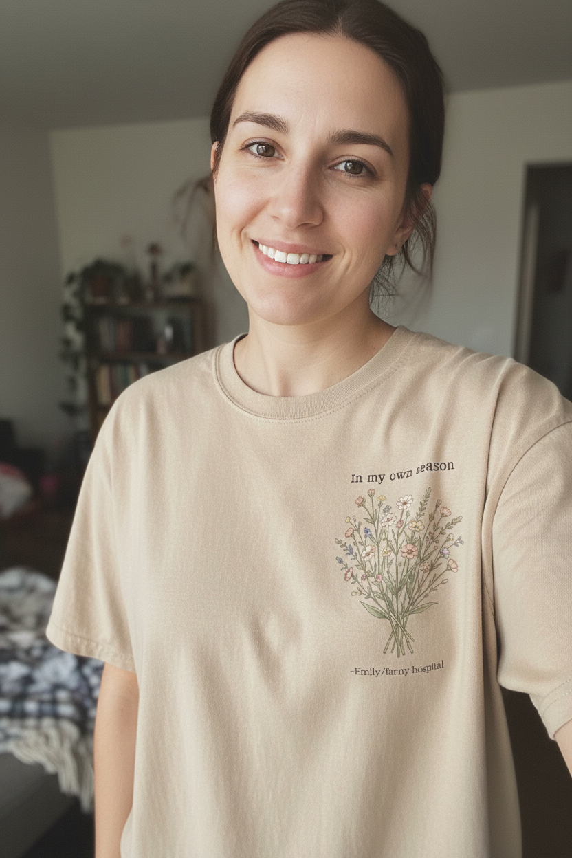 Cream T-shirt with small botanical bouquet graphic and centered text detail