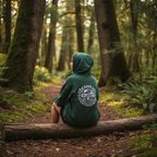 Forest green hooded sweatshirt with back “Save the Planet” emblem, hood up