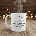 White ceramic mug with “goodluck” and “shine bright & chase your dreams” on front