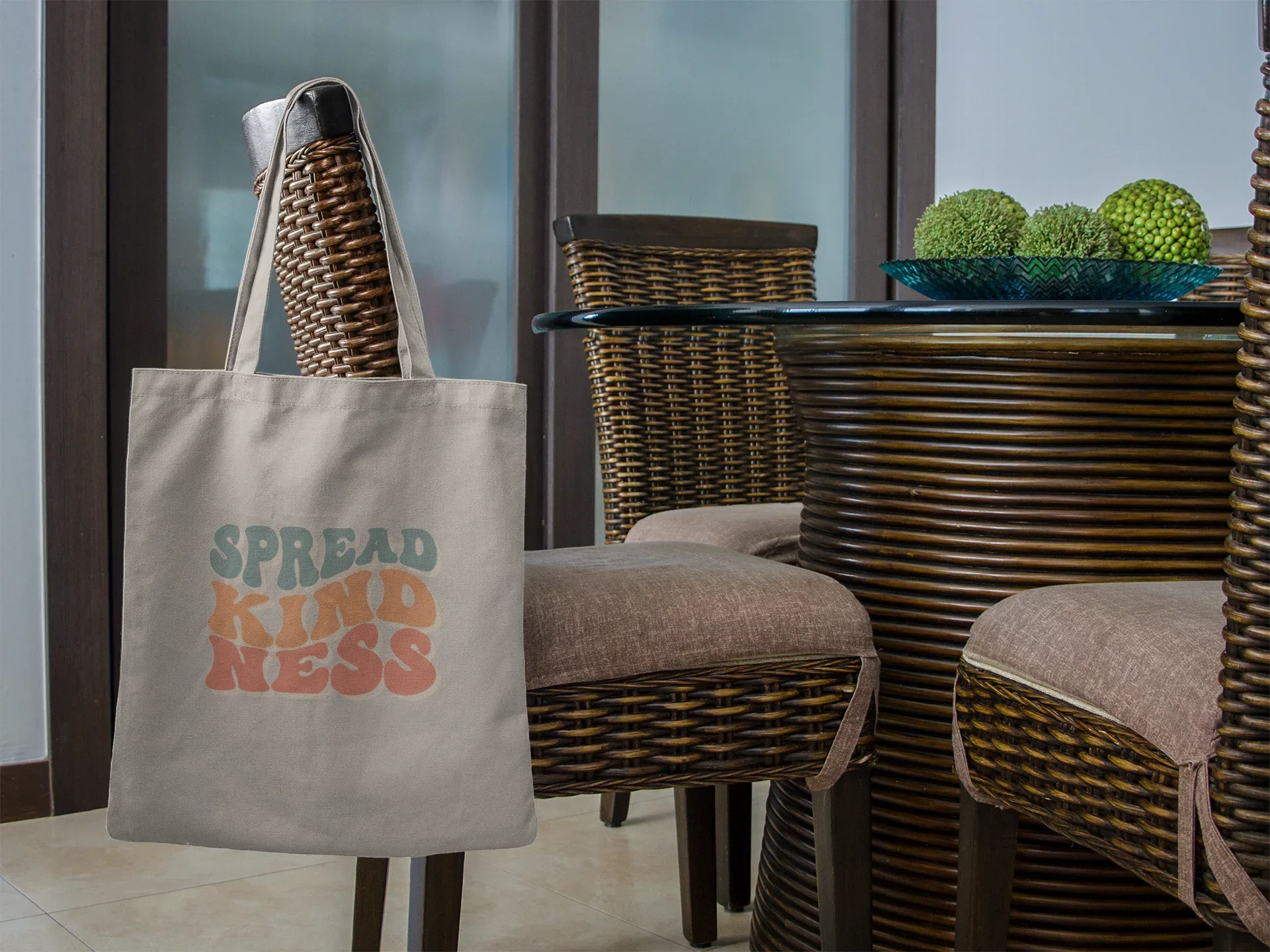 Light gray cotton tote bag with 'SPREAD KINDNESS' graphic on the front