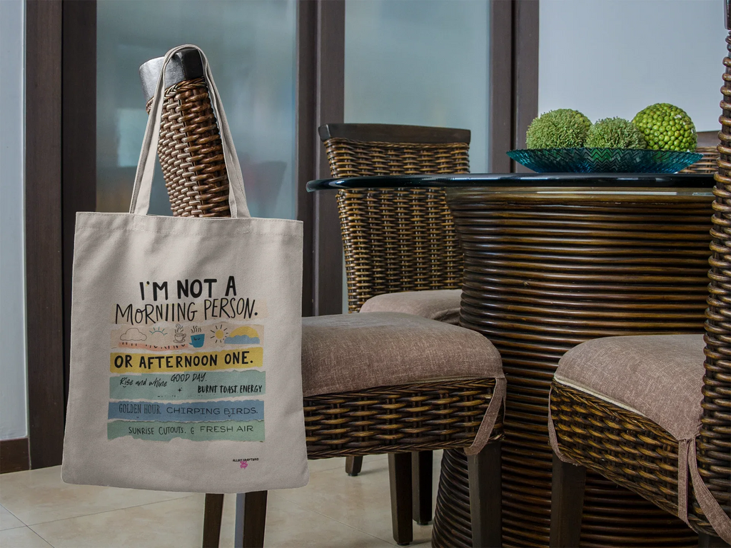 Light canvas tote bag with printed slogan and short handles