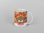 White ceramic bear mug with flames artwork and red “CENSORED” label, isolated front view.