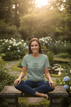 Teal crew-neck T-shirt with “GOOD ENERGY ONLY” graphic on the chest, worn by model