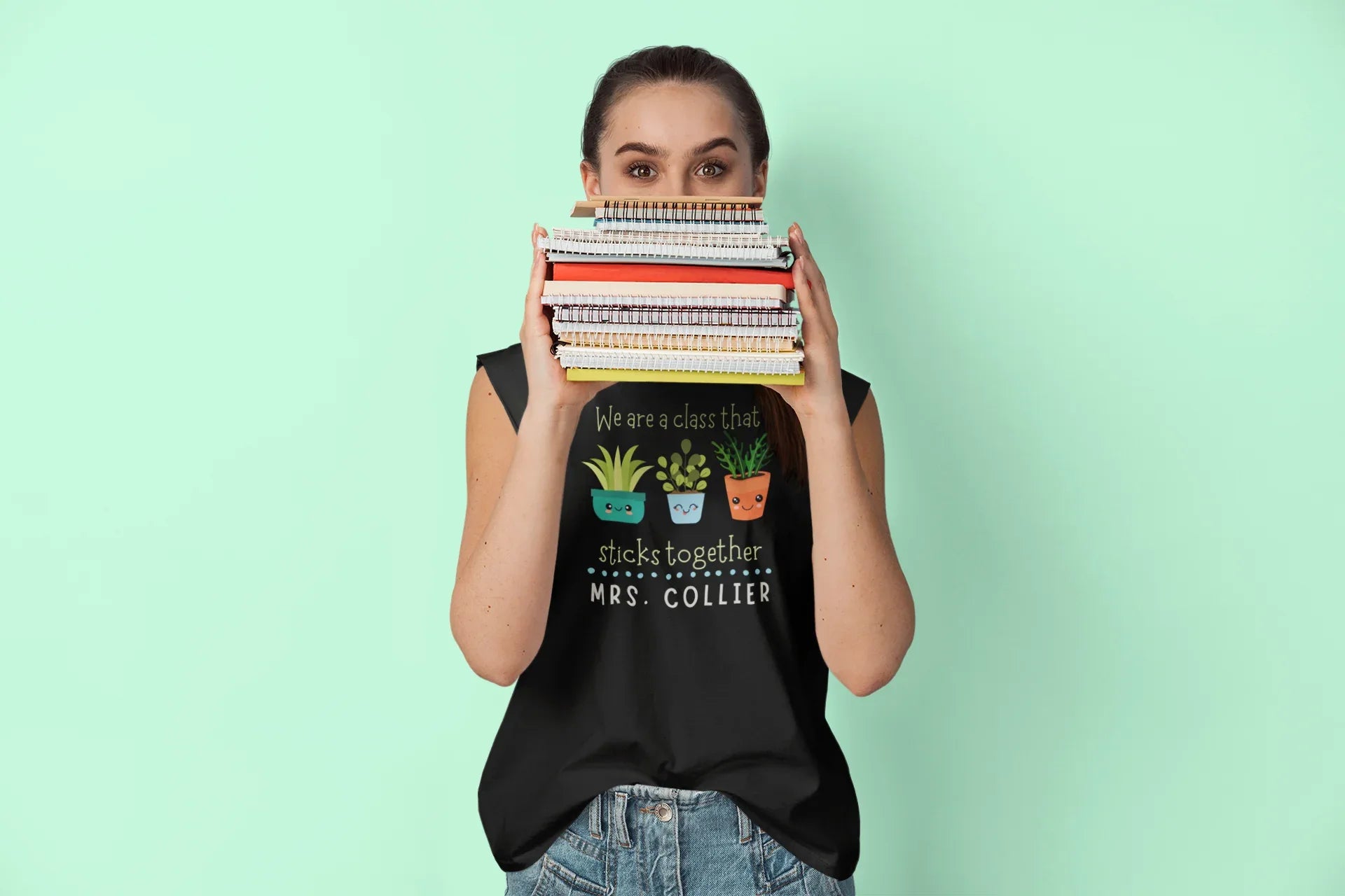 Black crewneck T-shirt with cartoon classroom icons and 'MRS. COLLIER' text.