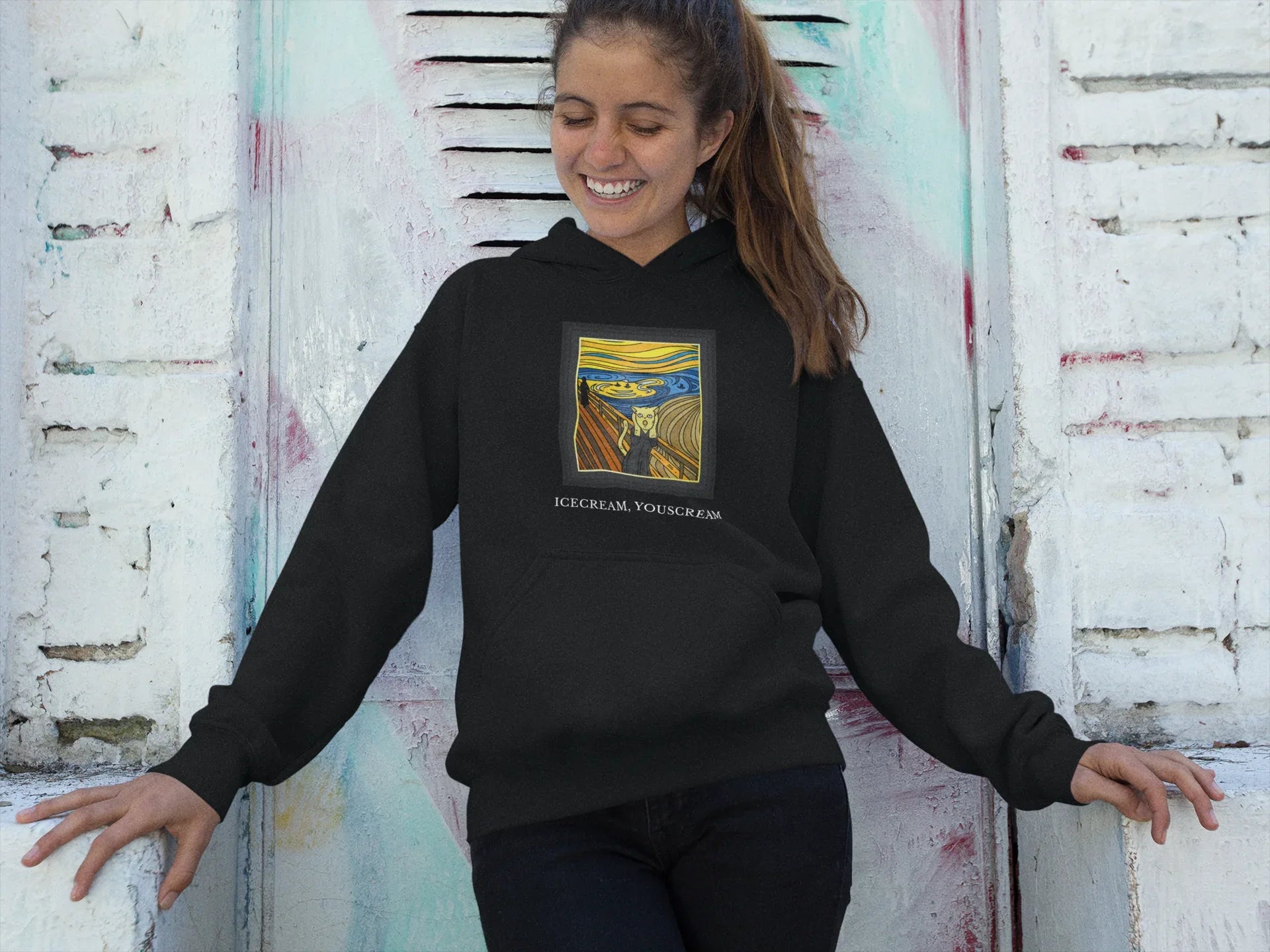 Black pullover hoodie with hood, front colorful square graphic print and small ICECREAM text.