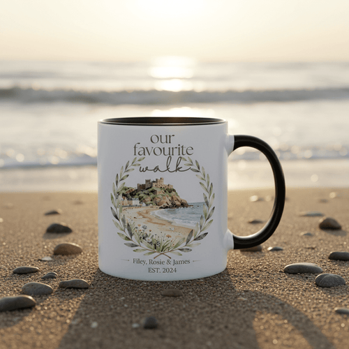 White ceramic mug with black handle, “our favourite walk” watercolour wreath design