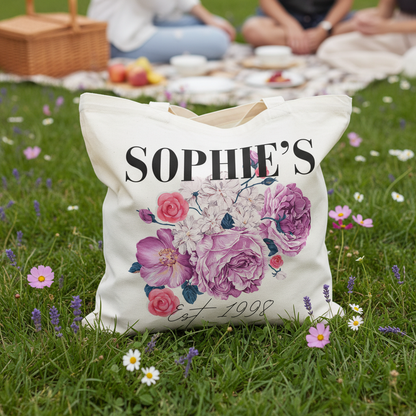 SOPHIE'S tote on grass with wildflowers