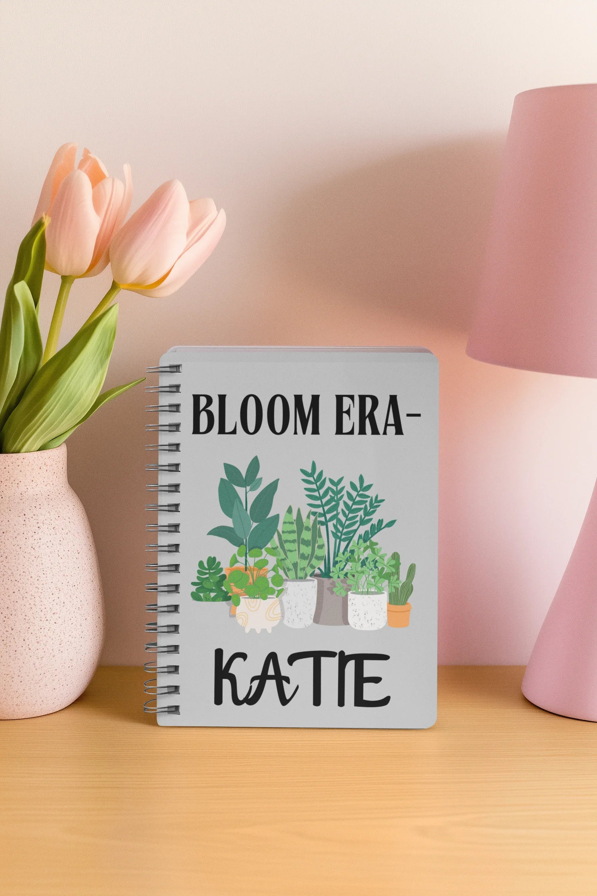 Cream A5 notebook with spiral binding, plant pots illustration and name KATTE