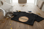 Black crewneck T-shirt with tree-ring “Seasoned, Not Old” graphic