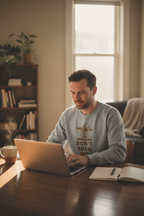 Gray sloth graphic sweatshirt worn by man with “DON’T RUSH ME” front print
