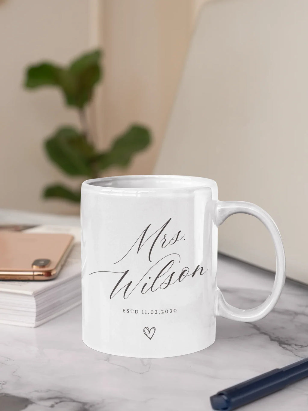 White ceramic mug with 'Mrs Wilson' script, 'ESTD 11.02.2030' and heart icon