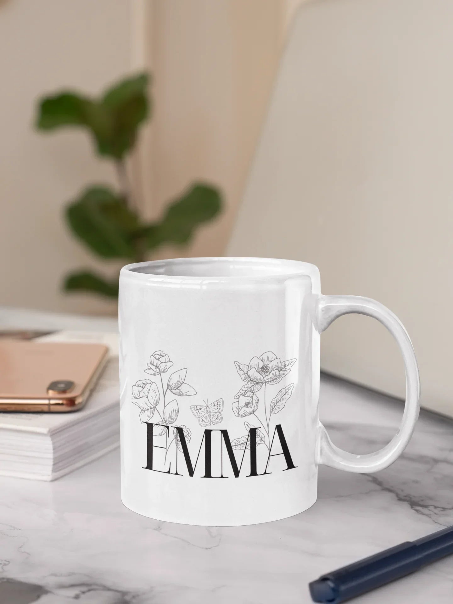 White ceramic mug with floral line art and name EMMA on front