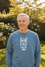Light blue crewneck sweatshirt with white 'best DAD ever' print, worn by man outdoors