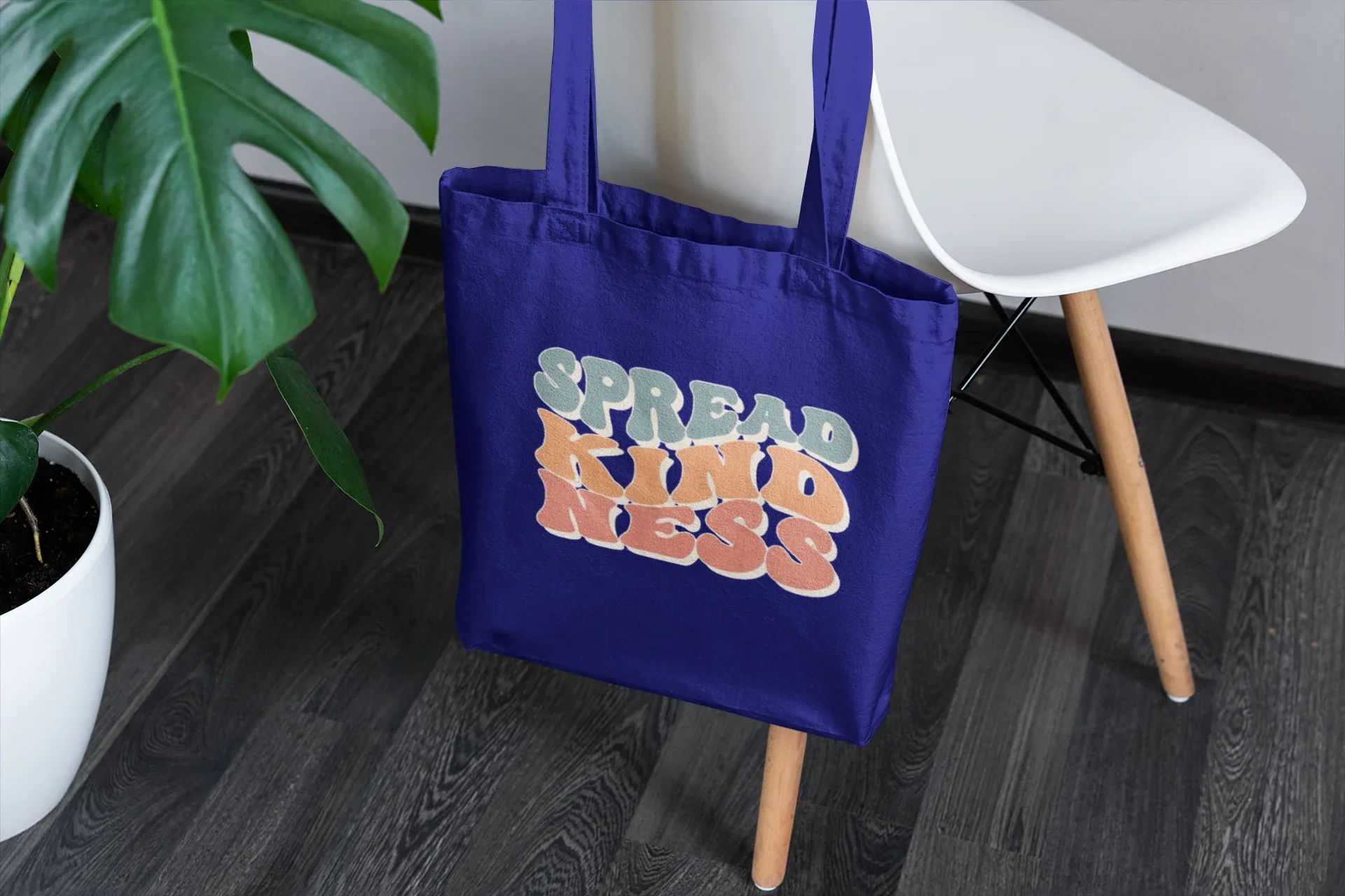 Royal blue cotton tote bag with 'SPREAD KINDNESS' graphic on the front
