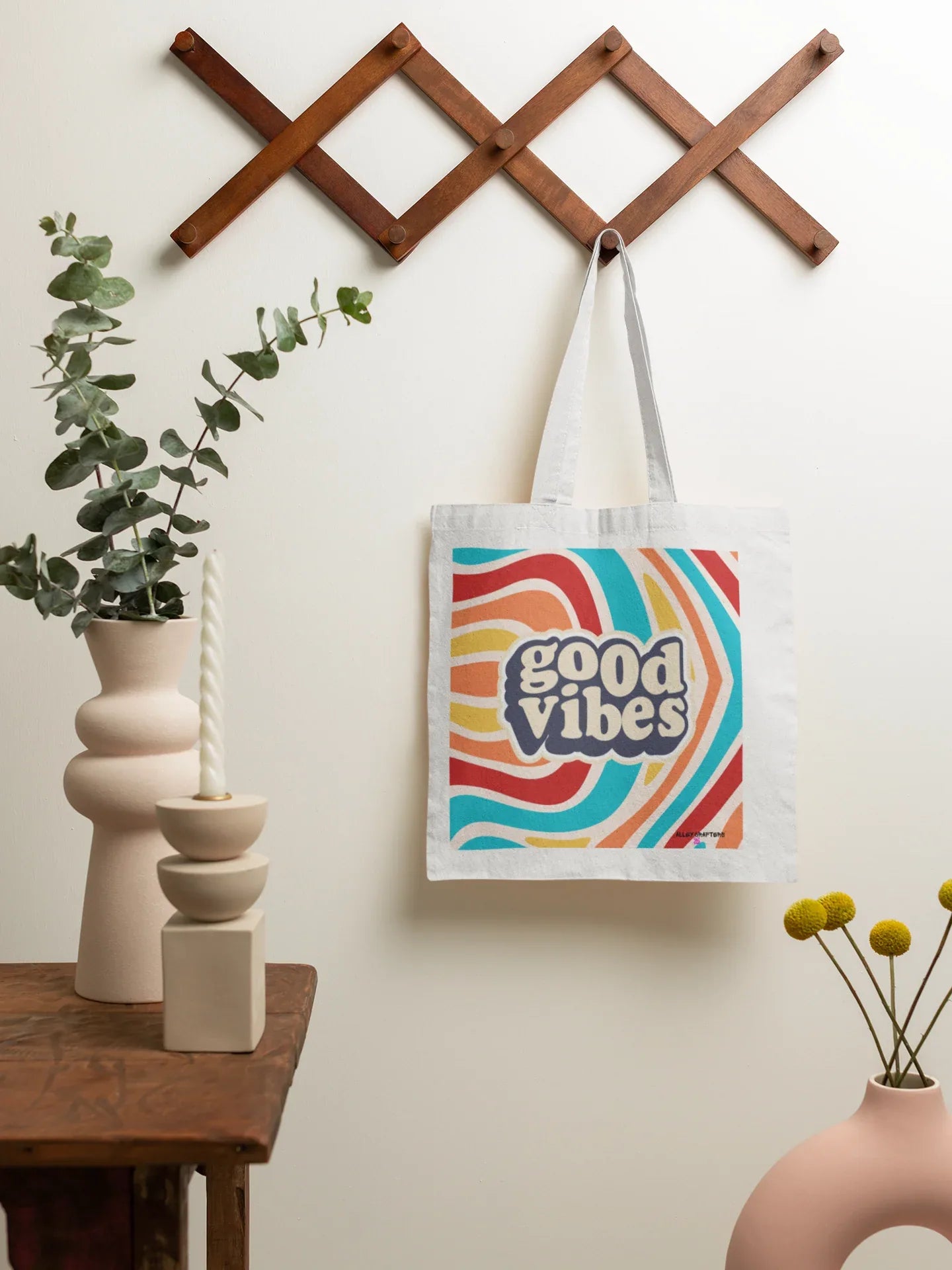 White tote bag with “good vibes” logo, long fabric handles