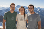 Nature graphic T-shirts on three people in green, white, and blue with chest logos