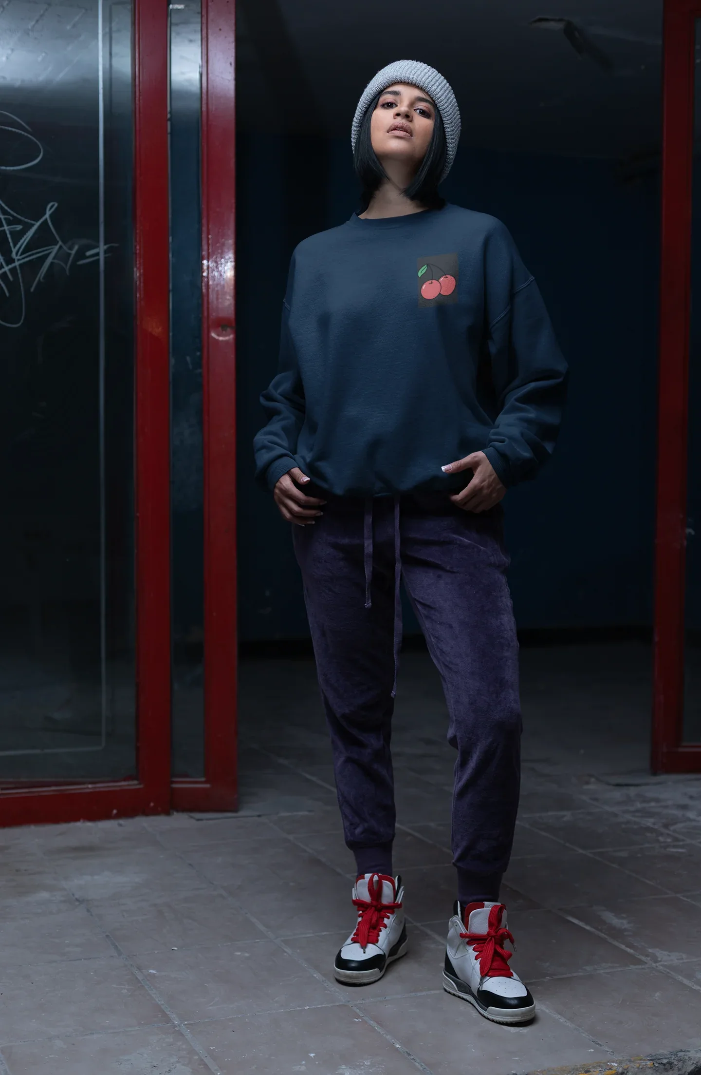 Navy crewneck sweatshirt with cherry embroidery patch on the left chest