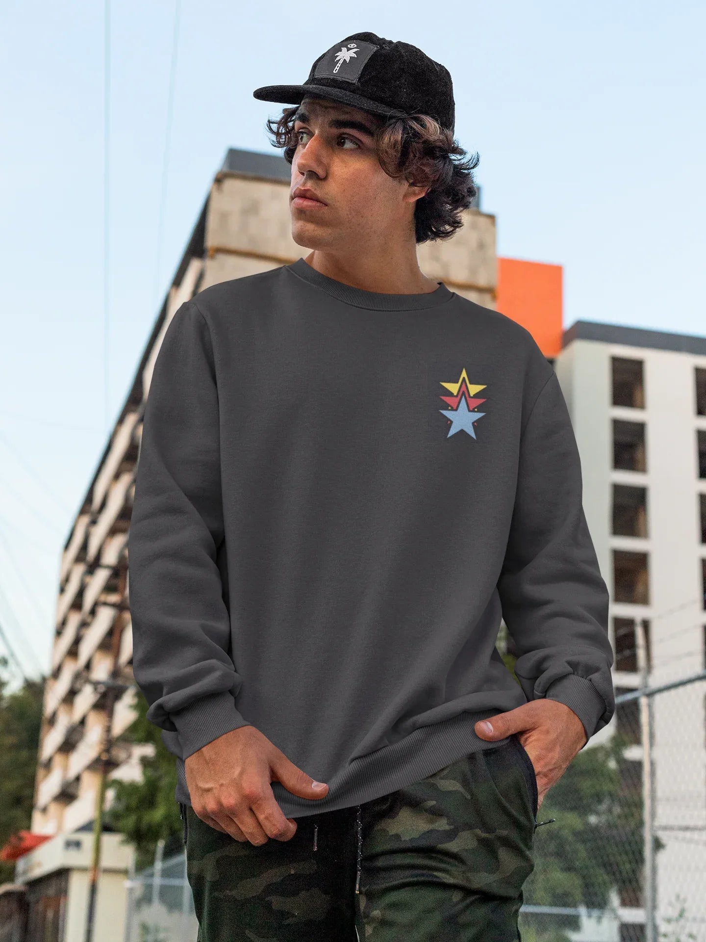 Unisex black sweatshirt, star embroidery on chest, relaxed fit
