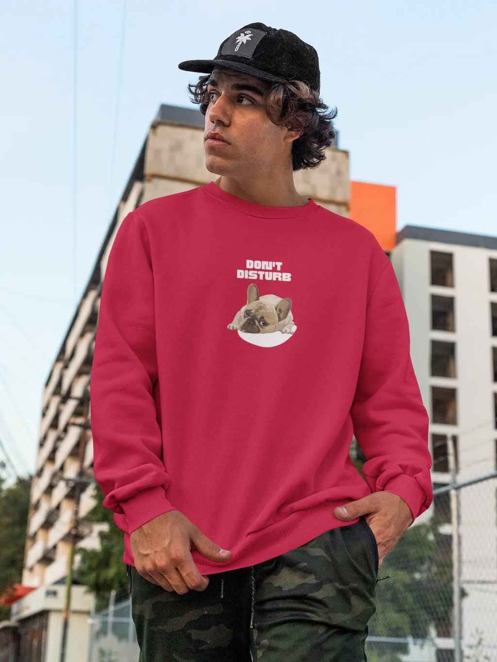Red sweatshirt with “DON’T DISTURB” text and sleeping French Bulldog graphic.