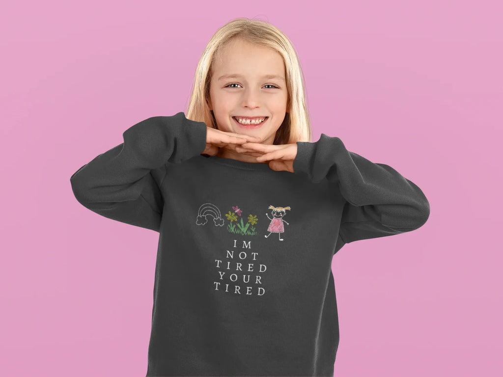 Charcoal kids sweatshirt with 'I'm Not Tired, You're Tired' character graphic on chest
