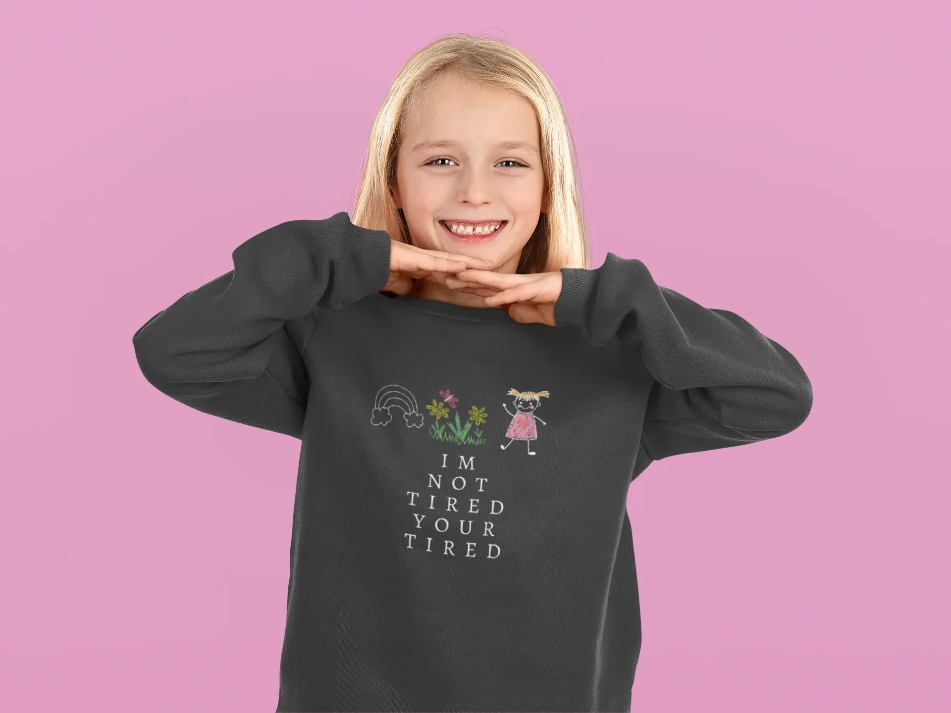 Charcoal kids sweatshirt with 'I'm Not Tired, You're Tired' character graphic on chest