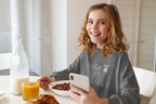 Charcoal kids sweatshirt with 'I'm Not Tired, You're Tired' character graphic on chest