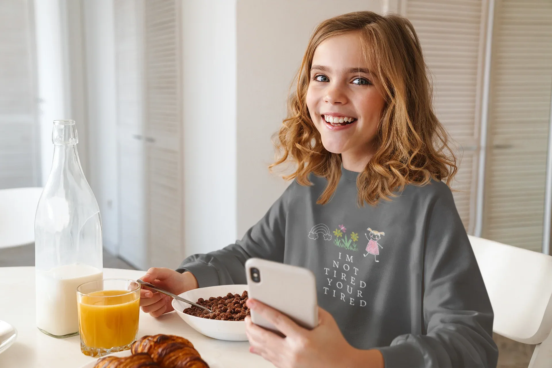 Charcoal kids sweatshirt with 'I'm Not Tired, You're Tired' character graphic on chest