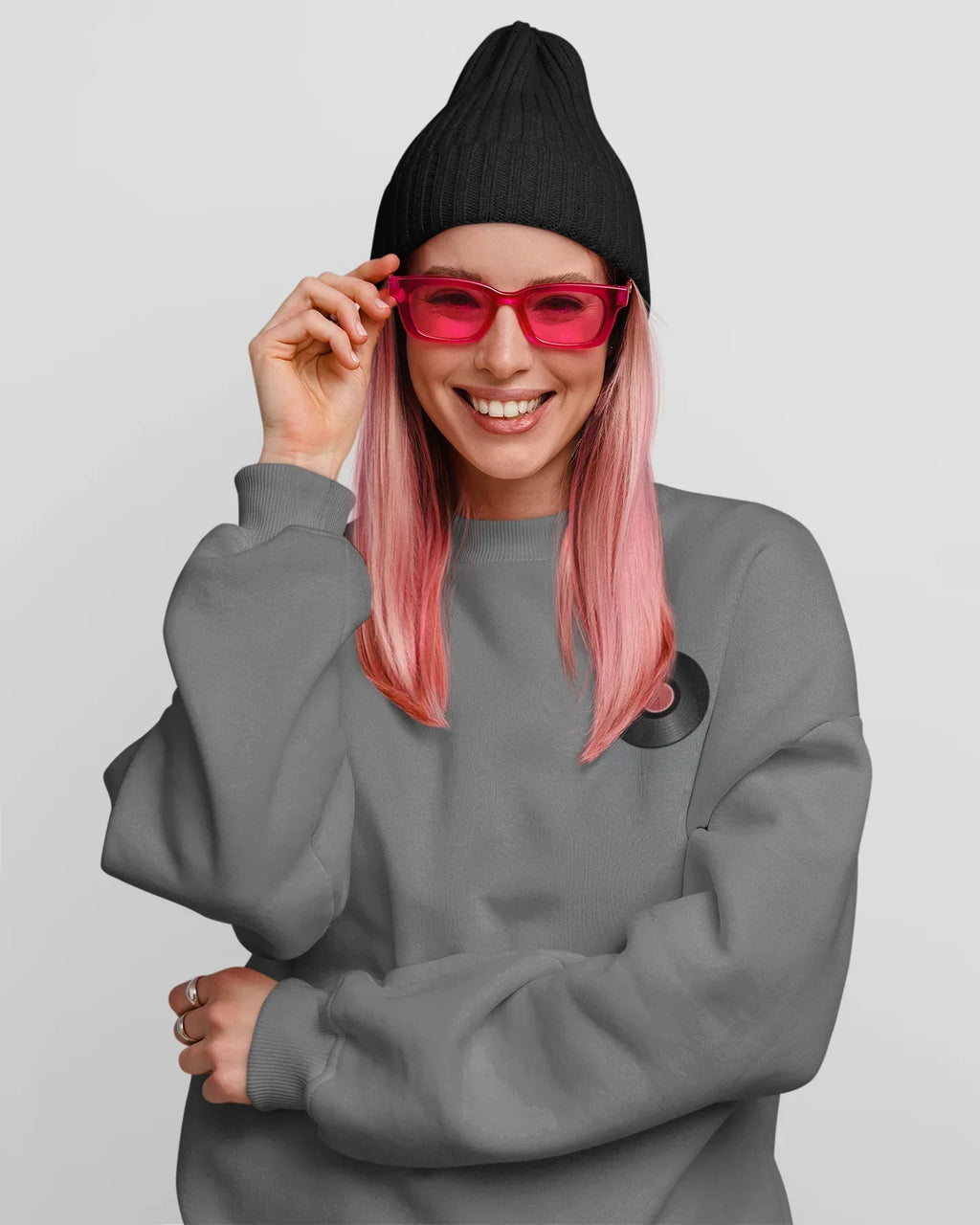 Dark heather crewneck sweatshirt with embroidered record player patch on chest
