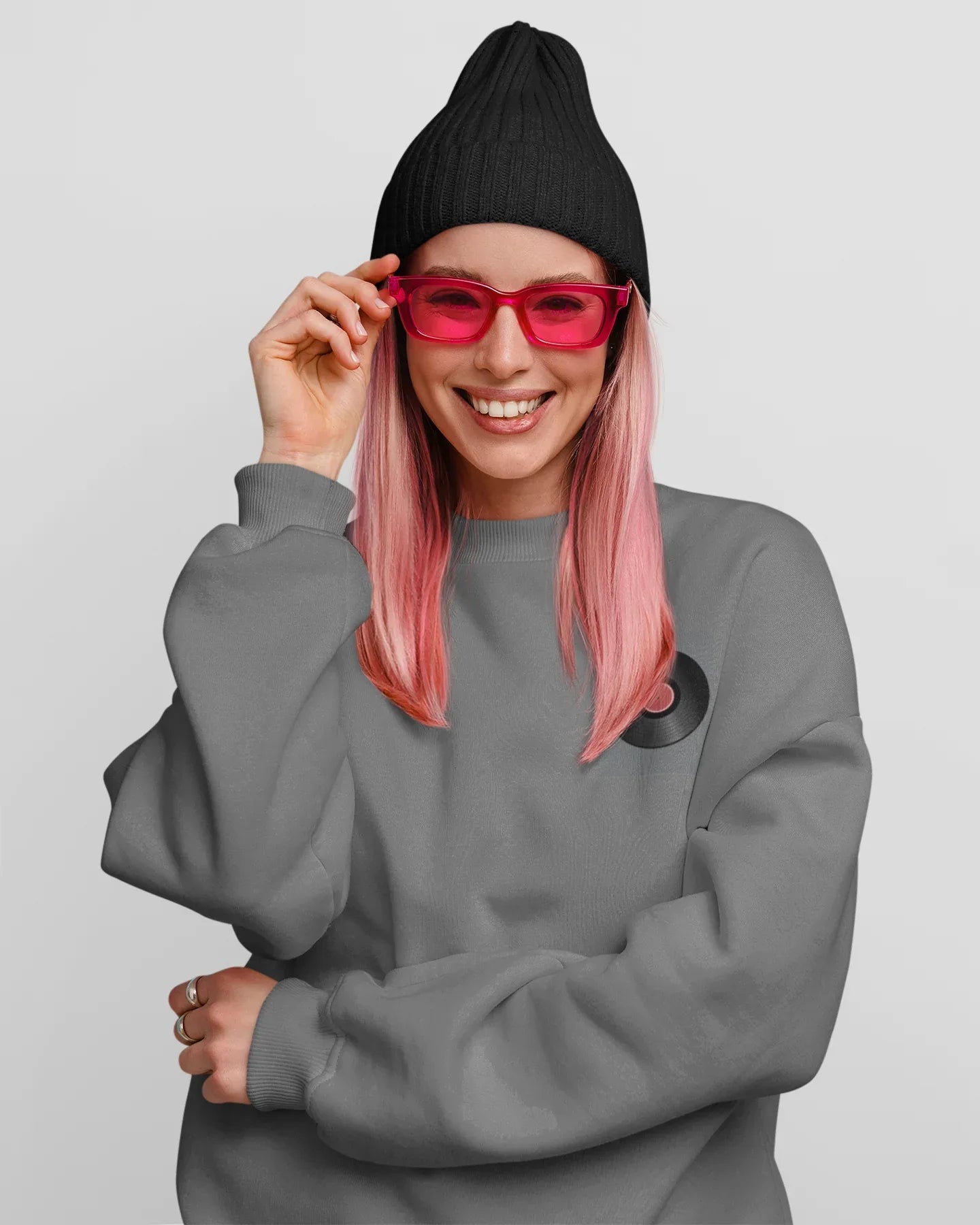 Dark heather crewneck sweatshirt with embroidered record player patch on chest