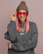 Dark gray crewneck sweatshirt with space-themed graphic and long sleeves.