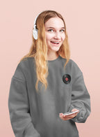 Dark heather crewneck sweatshirt with embroidered record player patch on chest