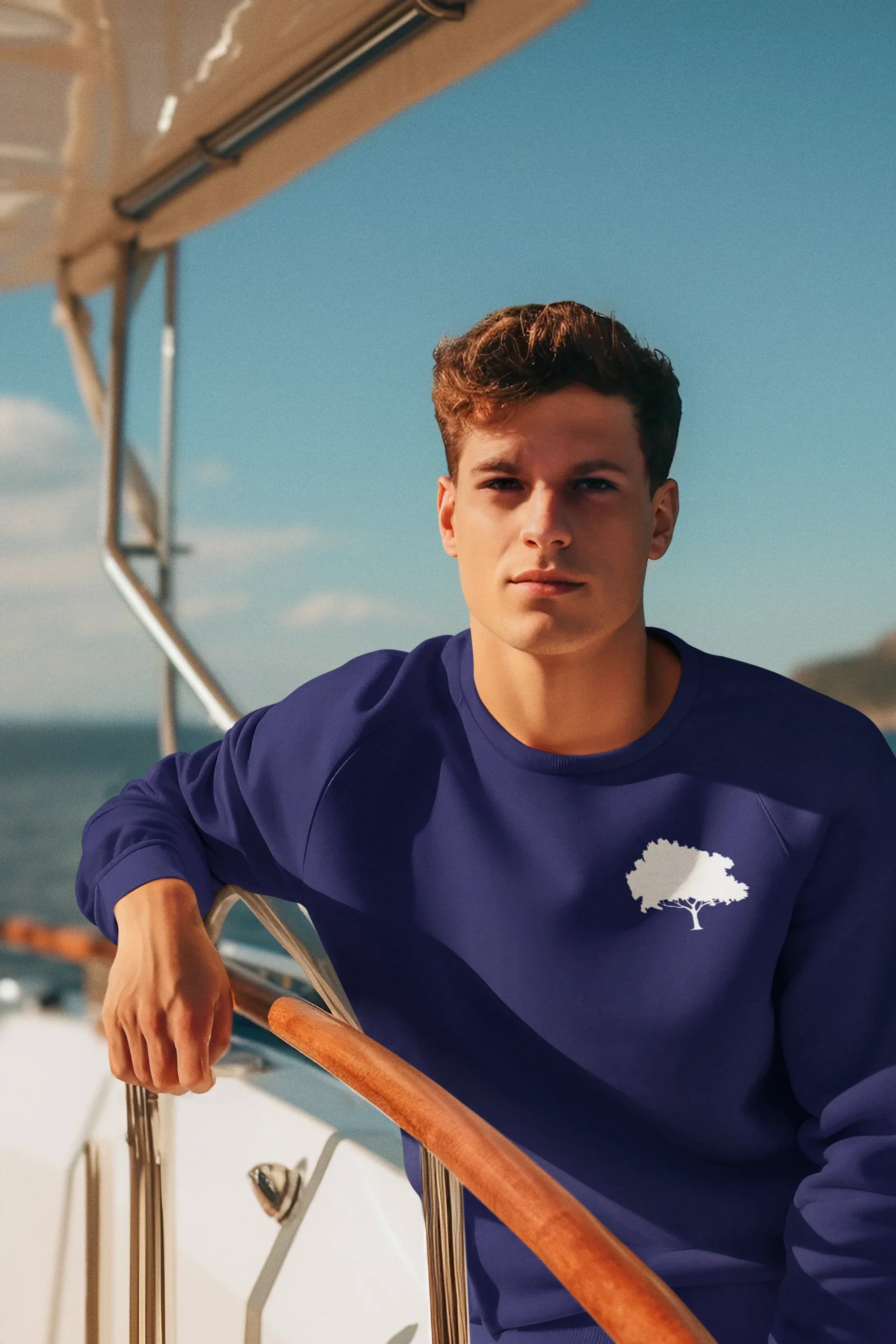 Navy sweatshirt with a white snail emblem on the front chest.