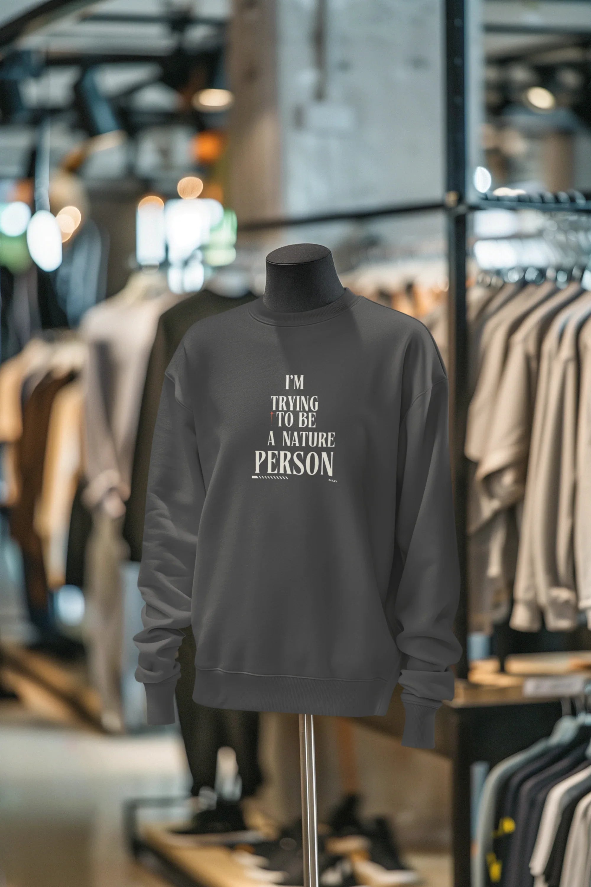 Charcoal crewneck sweatshirt with 'I’M TRYING TO BE A NATURE PERSON' front text