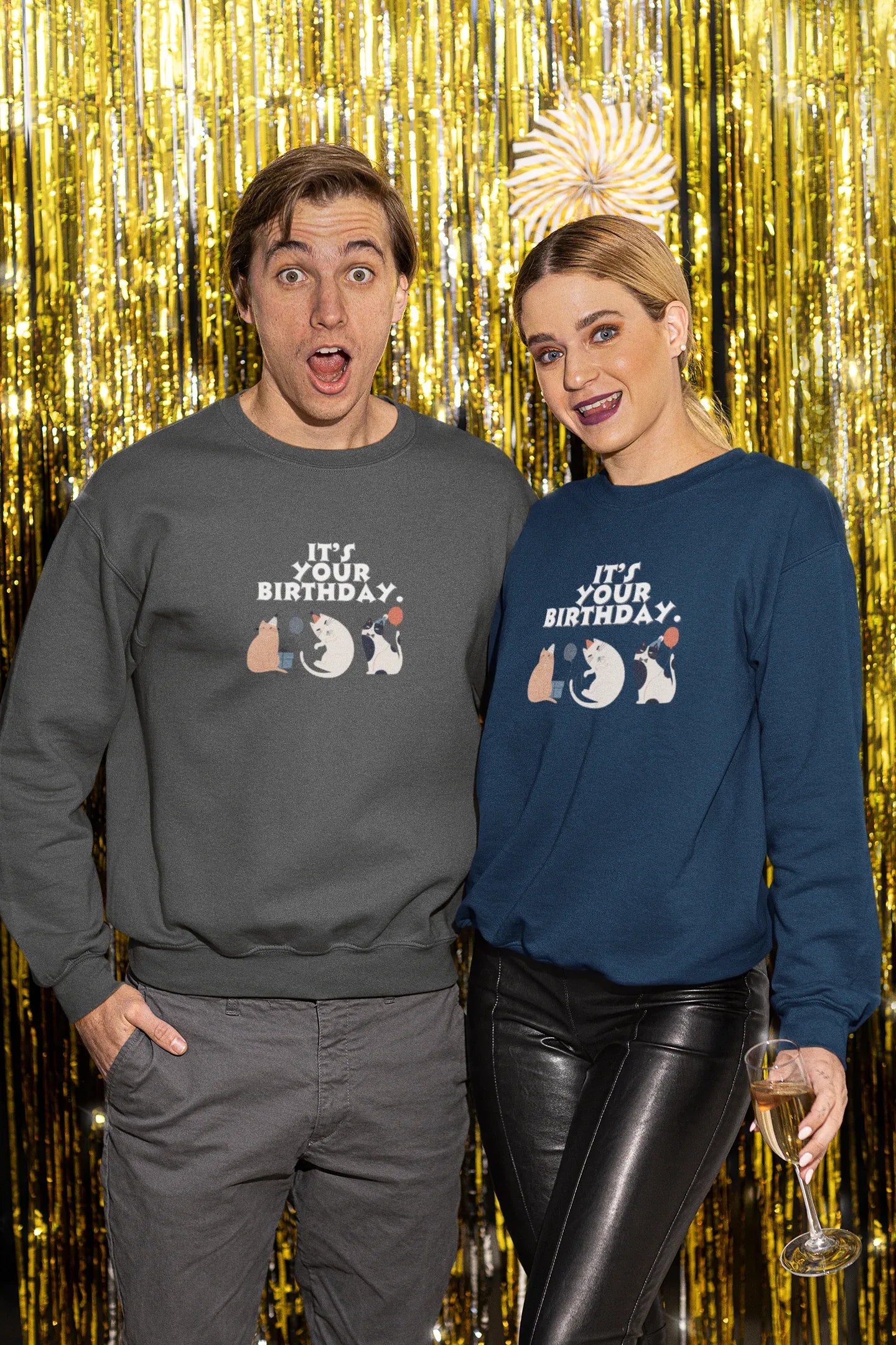 Cat birthday crewneck sweatshirts worn by two people: dark gray and navy, front print