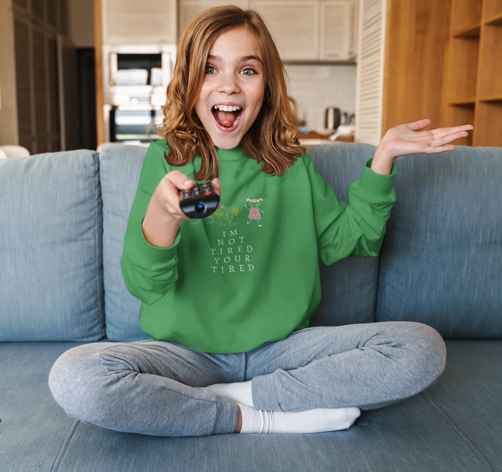 Kelly green kids sweatshirt with character graphic and 'I'm Not Tired, You're Tired' text