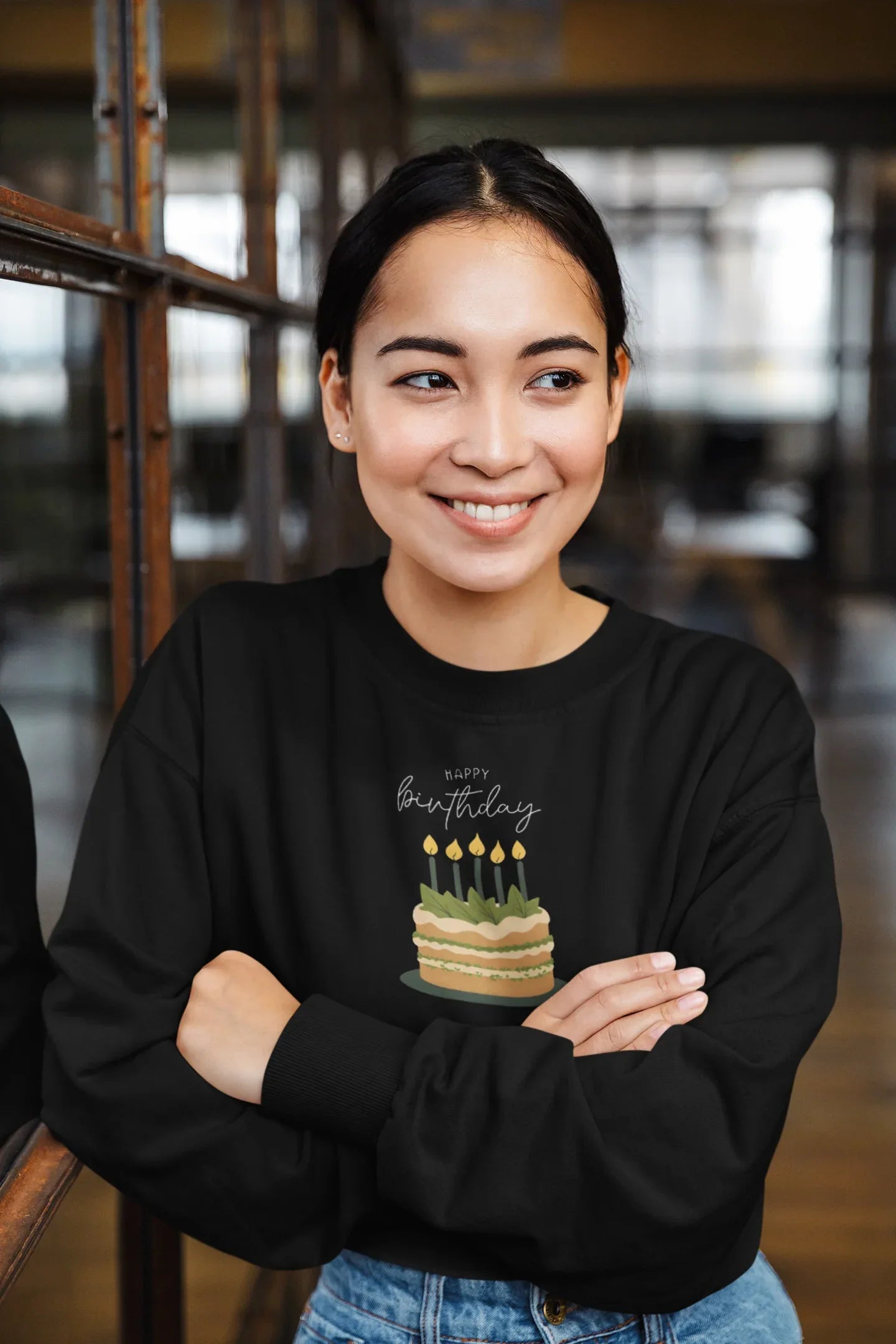 Black crewneck sweatshirt with “Happy birthday” cake and candle graphic