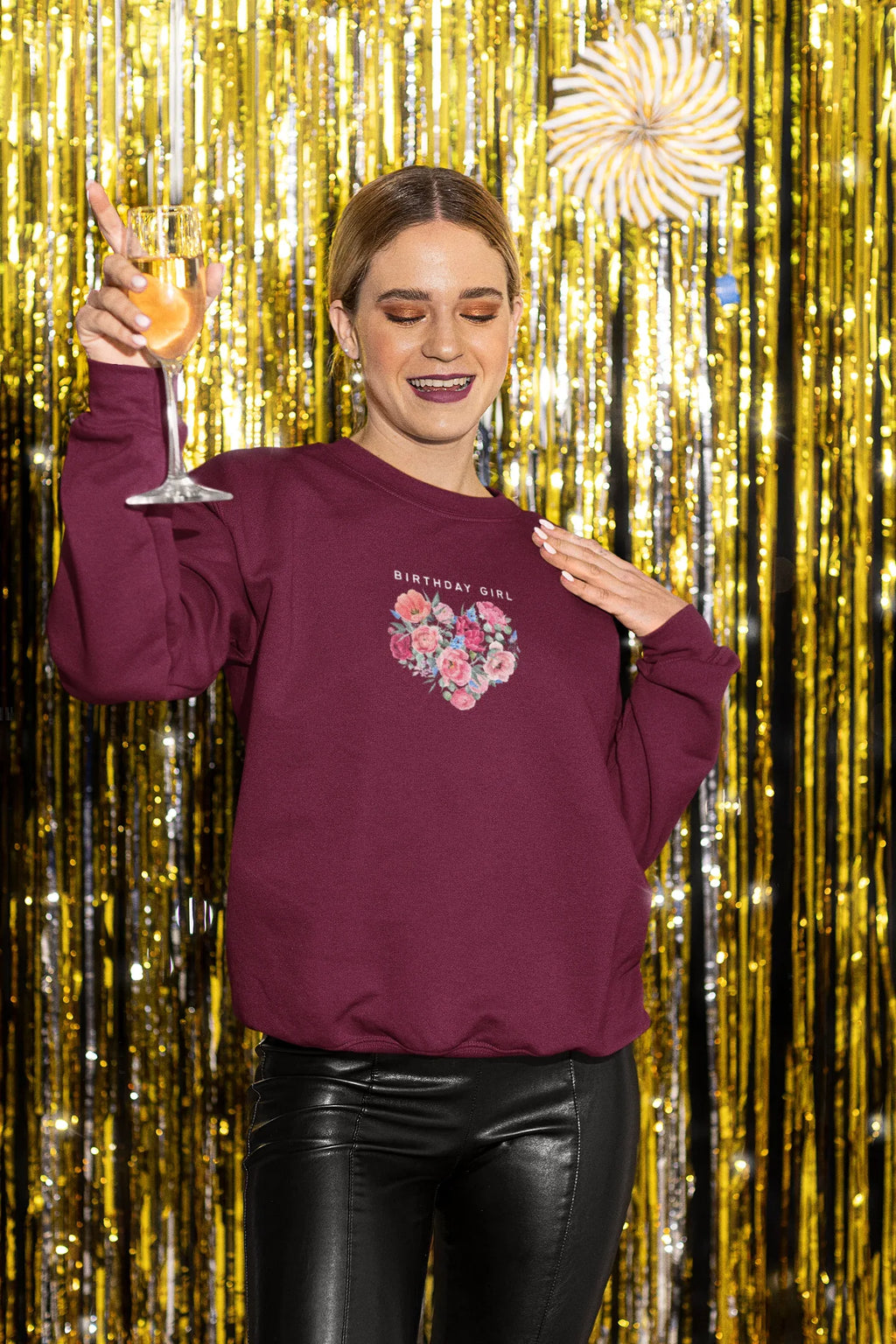 Maroon sweatshirt with “BIRTHDAY GIRL” text and floral heart graphic